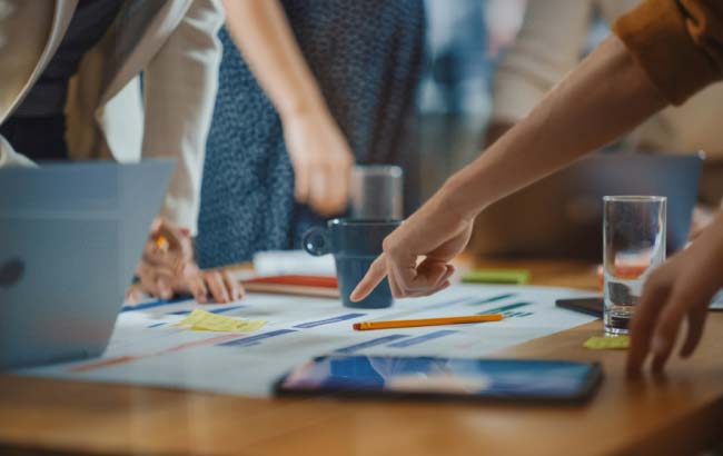 Marketers collaborating on campaign strategy – improving website visibility through SEO
