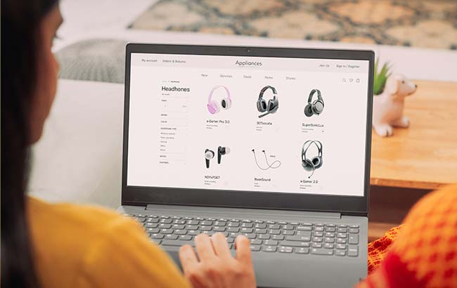 Woman browsing an online store for headphones, representing eCommerce SEO strategy