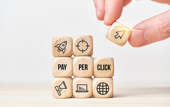 Pay-per-click (PPC) concept blocks symbolising SEM strategy and online advertising