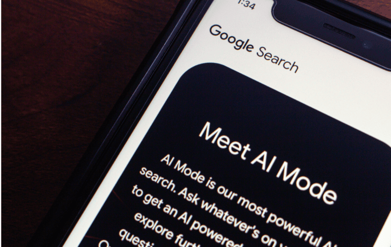 Smartphone showing Google Search with AI Mode, representing AI-powered search experiences for AI SEO.
